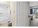 Bathroom adjacent to bedroom showcasing tub-shower combo and trash can at 2805 N Ocean Blvd. # 214, Myrtle Beach, SC 29577