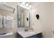 Bathroom featuring a modern sink and mirror and conveniently placed towel racks at 2805 N Ocean Blvd. # 214, Myrtle Beach, SC 29577
