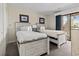 Bedroom showcasing two twin beds, ocean-themed decor, and a sliding glass door to a patio at 2805 N Ocean Blvd. # 214, Myrtle Beach, SC 29577