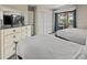 Comfortable bedroom features two beds and access to a private balcony at 2805 N Ocean Blvd. # 214, Myrtle Beach, SC 29577