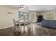 Bright dining area with a ceiling fan and sliding glass doors leading to a patio at 2805 N Ocean Blvd. # 214, Myrtle Beach, SC 29577