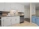 Bright kitchen featuring white cabinets, stainless steel appliances, and tiled backsplash at 2805 N Ocean Blvd. # 214, Myrtle Beach, SC 29577
