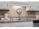 Modern kitchen featuring a stainless steel sink and granite countertops at 2805 N Ocean Blvd. # 214, Myrtle Beach, SC 29577