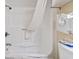 Clean shower-tub combination with a white shower curtain and fresh towels at 2805 N Ocean Blvd. # 214, Myrtle Beach, SC 29577