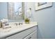 Cozy bathroom with marble countertops, decorative mirrors, and white cabinets at 4808 Cantor Ct., North Myrtle Beach, SC 29582