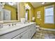 Spacious bathroom featuring and sinks, white cabinets, and decorative mirrors at 4808 Cantor Ct., North Myrtle Beach, SC 29582