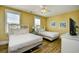 Cozy bedroom with two beds, light walls, and a ceiling fan for a relaxing atmosphere at 4808 Cantor Ct., North Myrtle Beach, SC 29582