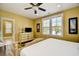 Bright bedroom featuring a comfortable bed, plantation shutters, and hardwood flooring at 4808 Cantor Ct., North Myrtle Beach, SC 29582