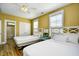 A comfortable bedroom with two beds and an adjoining bathroom at 4808 Cantor Ct., North Myrtle Beach, SC 29582