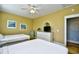 A comfy bedroom features two beds with white comforters, a TV and chair at 4808 Cantor Ct., North Myrtle Beach, SC 29582