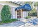 Inviting entrance to Cinzia Spa, featuring a stylish awning and lush greenery for a serene welcome at 4808 Cantor Ct., North Myrtle Beach, SC 29582