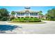 Grand two-story building with manicured landscaping, showcasing a welcoming entrance and elegant architecture at 4808 Cantor Ct., North Myrtle Beach, SC 29582