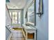 Bright foyer with wood flooring, stairwell, and coastal-themed decorations at 4808 Cantor Ct., North Myrtle Beach, SC 29582