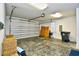 A large garage featuring a rolling door, trash can, chairs and yoga mat at 4808 Cantor Ct., North Myrtle Beach, SC 29582
