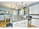 Well-lit kitchen featuring granite countertops, stainless steel appliances, and a stylish dining area at 4808 Cantor Ct., North Myrtle Beach, SC 29582