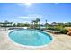 Sparkling outdoor pool surrounded by lounge chairs and palm trees for ultimate relaxation under the sun at 4808 Cantor Ct., North Myrtle Beach, SC 29582