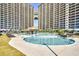 Stunning view of pools surrounded by towering buildings, perfect for relaxation and recreation at 4808 Cantor Ct., North Myrtle Beach, SC 29582