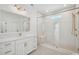 Bright bathroom featuring a double sink vanity, glass shower, and gold fixtures at 1099 Milford Way, Myrtle Beach, SC 29588