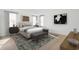Bright bedroom featuring a bed with a bench, bedside tables, and large windows at 1099 Milford Way, Myrtle Beach, SC 29588