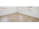 Bright empty bedroom featuring light hardwood flooring and large windows at 1099 Milford Way, Myrtle Beach, SC 29588
