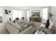 Stylish living room with comfortable seating, modern decor, and bright natural light from large windows at 1099 Milford Way, Myrtle Beach, SC 29588