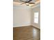 Bright bedroom with wood-look floors and ceiling fan at 110 Hallandale Lane, Murrells Inlet, SC 29576