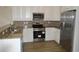 Modern kitchen with stainless steel appliances and granite countertops at 110 Hallandale Lane, Murrells Inlet, SC 29576