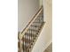 Interior view of a staircase with wooden steps and wrought iron railing at 110 Hallandale Lane, Murrells Inlet, SC 29576