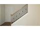 Elegant staircase with wood railing and wrought-iron balusters at 110 Hallandale Lane, Murrells Inlet, SC 29576