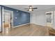 Spacious bedroom with light wood floors and ceiling fan at 118 Sly Fox Trail, Myrtle Beach, SC 29588