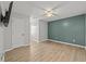 Simple bedroom with wood floors and green accent wall at 118 Sly Fox Trail, Myrtle Beach, SC 29588