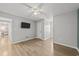 Bright bedroom with laminate flooring, ceiling fan, and ample closet space at 118 Sly Fox Trail, Myrtle Beach, SC 29588