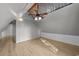 Bonus room with vaulted ceiling, wood-look floors, and skylight at 118 Sly Fox Trail, Myrtle Beach, SC 29588