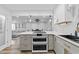 Updated kitchen featuring double oven, white cabinets and a large island at 118 Sly Fox Trail, Myrtle Beach, SC 29588