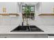 Modern kitchen sink with gold faucet and white cabinets at 118 Sly Fox Trail, Myrtle Beach, SC 29588