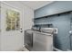 Laundry room with washer, dryer, and shelving at 118 Sly Fox Trail, Myrtle Beach, SC 29588
