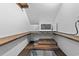 Small pantry with wooden shelves and microwave at 118 Sly Fox Trail, Myrtle Beach, SC 29588