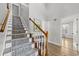 Elegant staircase with a runner and light-colored wood at 118 Sly Fox Trail, Myrtle Beach, SC 29588