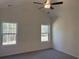 Bright bedroom with plush carpeting, natural light and neutral tones create a calm and inviting sanctuary at 216 Palmetto Sand Loop, Conway, SC 29527