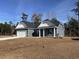Inviting single-story home with blue siding, white trim, a two-car garage, and a neatly maintained front yard at 216 Palmetto Sand Loop, Conway, SC 29527