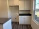 Practical kitchen storage solution with white cabinets and adjacent granite counter for efficient meal preparation and organization at 216 Palmetto Sand Loop, Conway, SC 29527