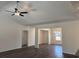 Bright living room showcasing vaulted ceilings, modern ceiling fan, and smooth transition to the dining space at 216 Palmetto Sand Loop, Conway, SC 29527