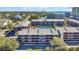 Aerial view of buildings with private balconies, and community tennis courts nearby at 212 2Nd Ave. N # 364, North Myrtle Beach, SC 29582