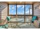 Relaxing screened-in balcony with comfortable seating, offering a serene outdoor living space at 212 2Nd Ave. N # 364, North Myrtle Beach, SC 29582