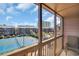 Balcony view overlooking tennis courts and community buildings under a bright, sunny sky at 212 2Nd Ave. N # 364, North Myrtle Beach, SC 29582