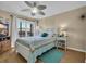 This bedroom features a ceiling fan and access to a balcony with a beautiful view at 212 2Nd Ave. N # 364, North Myrtle Beach, SC 29582
