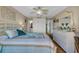 Comfortable bedroom with wood floors, light walls, and a calming design aesthetic at 212 2Nd Ave. N # 364, North Myrtle Beach, SC 29582