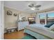 Bright bedroom with a ceiling fan, light-colored walls, and stylish, beach-themed decor at 212 2Nd Ave. N # 364, North Myrtle Beach, SC 29582