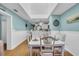 Bright dining room features hardwood floors and is open to kitchen and living area at 212 2Nd Ave. N # 364, North Myrtle Beach, SC 29582