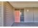 Exterior view of the entryway with a peach-colored front door and unit number at 212 2Nd Ave. N # 364, North Myrtle Beach, SC 29582